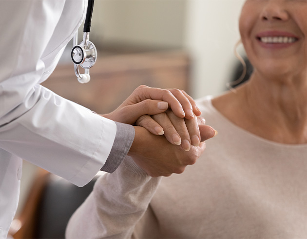 doctor holding the hand of their patient